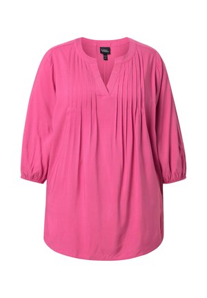 Kirkkaanpunainen pitkähihaisen pusero pliseeratulla etuosalla ja V-pääntiellä, joustavat hihansuut ja väljä istuvuus.