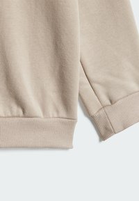 adidas Performance BADGE OF SPORT - Tuta - beige white