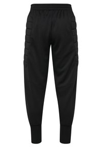 Svarta träningsbyxor med en tapered passform, gjorda av ett mjukt tyg. Har vadderade sidodetaljer och elastiska fållar vid anklarna.