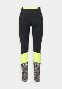 Höga leggings med svart huvudtyg, neongula accenter och leopardmönster vid underbenen. Slät yta, atletisk design.