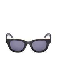 Gafas de sol estilo cat-eye con montura de carey oscuro, lentes morados y acento dorado en la parte superior. Patillas flexibles para mayor comodidad.