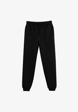Zwarte joggingsbroek van een gestructureerde stof, met een elastische tailleband met drawstrings en taps toelopende boorden bij de enkels.