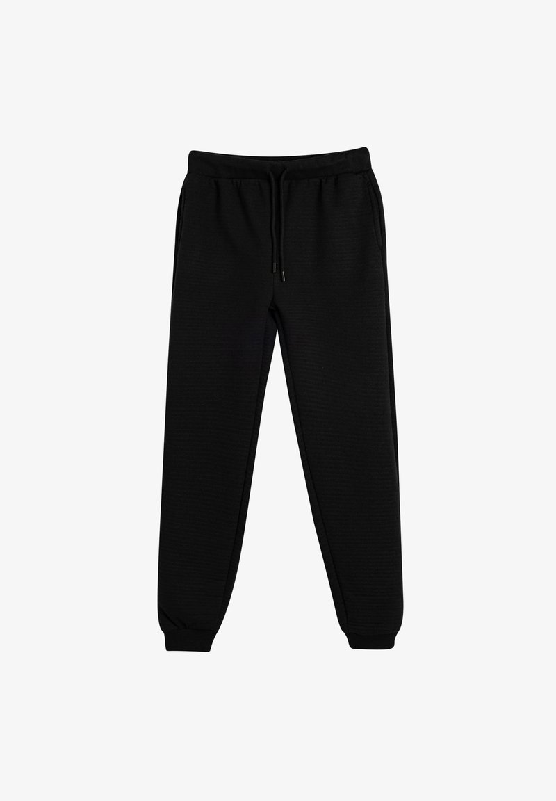 Schwarze Jogginghose aus strukturiertem Stoff, mit elastischem Bund und Kordelzügen sowie schmal zulaufenden Bündchen an den Knöcheln.