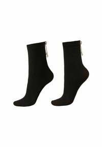 Sorte ankelstrømper med en glat tekstur, der har sølvkædeaccent og små dekorative perler fastgjort ved kanten.