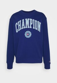 Navy blue cotton sweatshirt featuring "CHAMPION" in light blue lettering and a circular logo design on the chest. Ribbed cuffs and hem.
