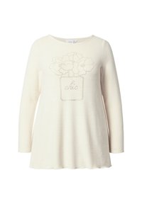 Langärmliges cremefarbenes Oberteil mit einem in Punkten gedruckten Blumenmuster, das auf der Vorderseite das Wort "chic" in einem quadratischen Muster zeigt. Weicher Stoff.
