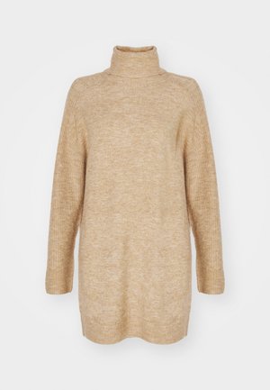 Bežasta dolčevita, oversized kroj, rebrasta tekstura na ovratniku i rukavima, pleteni materijal i dizajn s niskim ramenima.