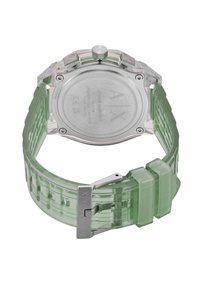 Διαφανής πράσινη σιλικονένια ζώνη ρολογιού με ατσάλινη οπίσθια πλευρά σε ασημί χρώμα, οκταγωνικό σχήμα και υφασμάτινη υφή στη ζώνη.