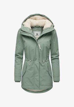Giacca impermeabile verde chiaro con rivestimento in morbido pellicciotto, vita regolabile con coulisse e due tasche frontali. Presenta un cappuccio e chiusura con zip.