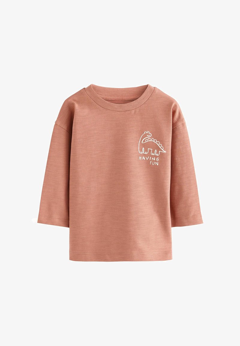 Roza majica s dolgimi rokavi in okroglim izrezom, ki na levi strani prsnega koša vsebuje bele vezenine dinozavra in napis "HAVING FUN".