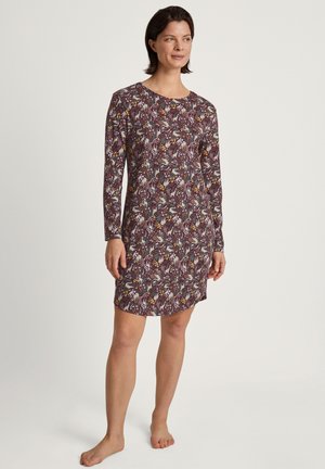 Nightdress a maniche lunghe con un motivo floreale in bordeaux, viola, giallo e verde. Tessuto morbido con scollatura arrotondata e vestibilità comoda.