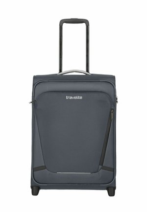 Gray suitcase with a structured design, fabric surface, retractable handle, smooth wheels, and zippered pockets for organized storage.