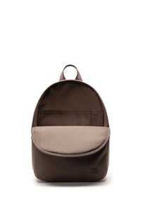 Brown fabric backpack with a rounded shape, top handle, and a flap closure; features a beige front pocket and interior compartment.