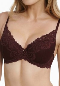 Mauve Spitzen-BH mit floralem Muster, Unterbruststütze, gewellten Kanten und verstellbaren Trägern. Textil mit strukturierter Oberfläche und glatter Optik.