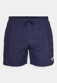 Shorts de bain bleu marine en tissu léger,avec une taille élastique à cordon de serrage et un logo imprimé sur le côté.