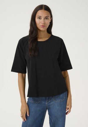 Black short-sleeve t-shirt with a wide crew neckline, made of smooth fabric, paired with light blue straight-leg jeans.