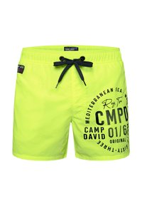 Pantaloni da bagno giallo neon con coulisse nera. Presentano un logo e un testo stampati. Tessuto leggero, stile shorts e vestibilità standard.