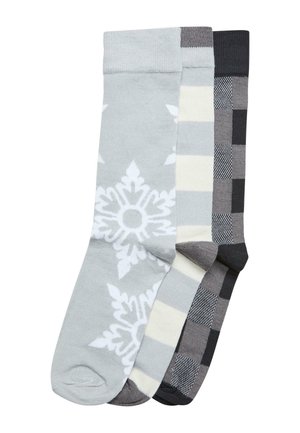 Three pairs of socks: light gray with a white snowflake pattern, gray stripes with cream, and dark gray checkered design. Soft knit material.