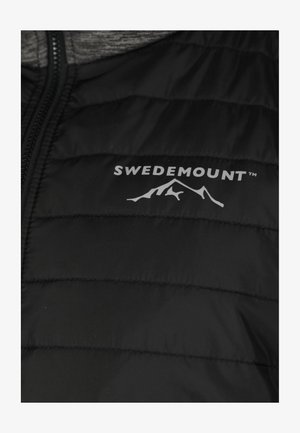 Black puffer jacket featuring quilted sections, a zip closure, and a white logo with mountain design on the left side. Soft texture.