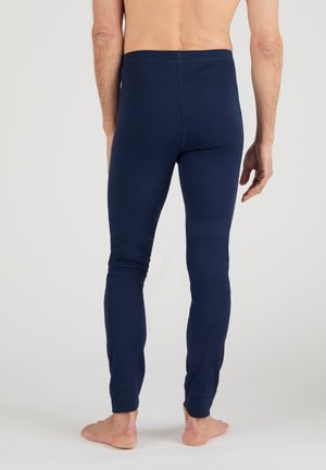 marineblaue Baumwollleggings mit taillierter Passform und elastischem Bund. Sie verfügen über eine glatte Textur und eng zulaufende Beine, die in gerippten Bündchen enden.