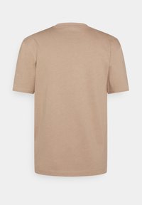 Short-sleeve, crew-neck t-shirt in light beige cotton. Smooth fabric texture with a simple design and no visible embellishments or patterns.