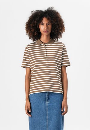 Brown and white striped polo shirt with a collar, featuring a three-button placket and a small logo on the chest. Worn with a denim skirt.