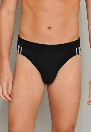 Schwarze Baumwollslips mit enger Passform, mit grauen Streifen an den Seiten und einem weichen elastischen Bund. Glatte Textur und klassisches Design.