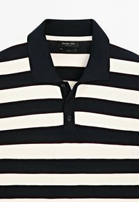 Black and white horizontally striped polo shirt with a black collar and two buttons, displayed against a plain background.