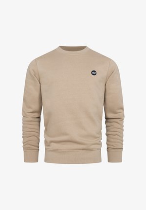 Sudadera beige de tejido suave, que presenta un cuello redondo, mangas largas, puños y dobladillo acanalados, y un pequeño logo redondo en el pecho.