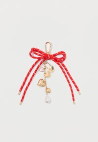 Red ribbon bow with a gold clip, featuring dangling gold hearts and a pearl accent. The ribbon has white stripes and finials.