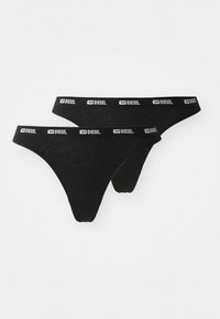 Svart tanga av mjukt material. Har en bred elastisk midjeband med "DIESEL"-logotyp i vitt. Visar två par.