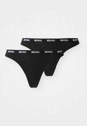 FioDental preto feito de material suave. Apresenta uma faixa elástica larga com a marca "DIESEL" em branco. Dois pares mostrados.