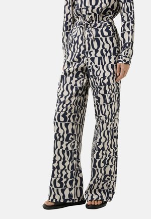 Patterned wide-leg trousers made of lightweight fabric, featuring navy and cream abstract shapes and a belted waist for a defined fit.