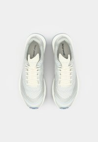 Lightweight athletic shoes in reflective silver mesh with cream laces, padded collar, and textured pattern on the upper.