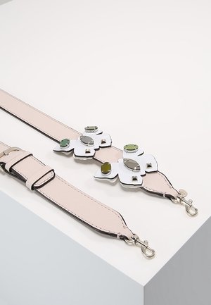 Two detachable light pink leather bag straps, one embellished with reflective green and silver geometric shapes and silver clasps.