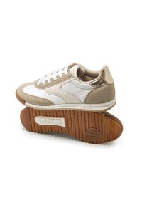 Sneakers with a white leather upper, beige suede accents, and a tan rubber sole. Features round laces and logo on heel. Flat, textured outsole.