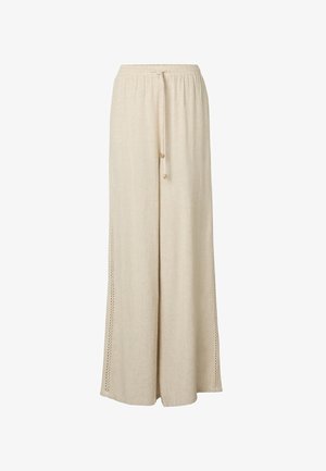 Pantalon beige à jambes larges avec taille élastique et cordon, avec des panneaux latéraux perforés pour plus de texture et de respirabilité.