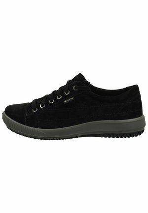 Black suede sneaker with lace closure, gray rubber outsole, metal eyelets, and Gore-Tex logo. Features a low-profile design with a rounded toe.