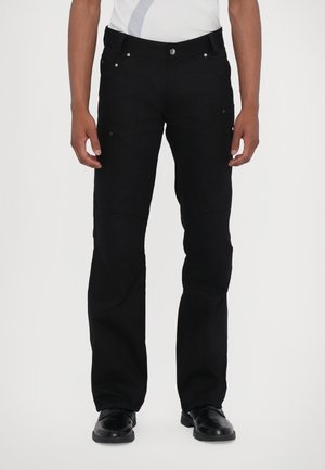 Black cargo pants made of durable fabric, featuring a straight cut, multiple pockets, and a button closure at the waist.