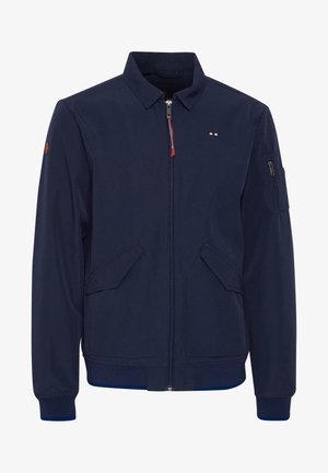 Tums zila bomber jakas ar rāvējslēdzēju, divām priekšējām kabatām un kabatu ar rāvējslēdzēju uz piedurknes. Iezīmēta ar ribotu apakšmalu un apkakli.