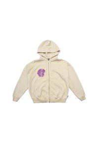 Felpa beige con zip e texture morbida. Presenta una grafica rotonda viola sul lato sinistro del petto, tasche laterali e polsini a coste.