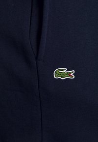 Lacoste PLUS - Calças de fato de treino - navy blue