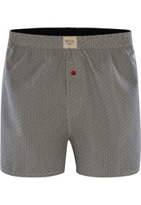 Boxershorts i svart och vitt randigt mönster med en röd knapp som accent. Tillverkade av lättviktsmaterial med resår i midjan.