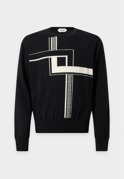 Pull noir à manches longues avec des lignes blanches en motif géométrique et clé grecque traversant le devant, col rond, poignets et ourlet côtelés.