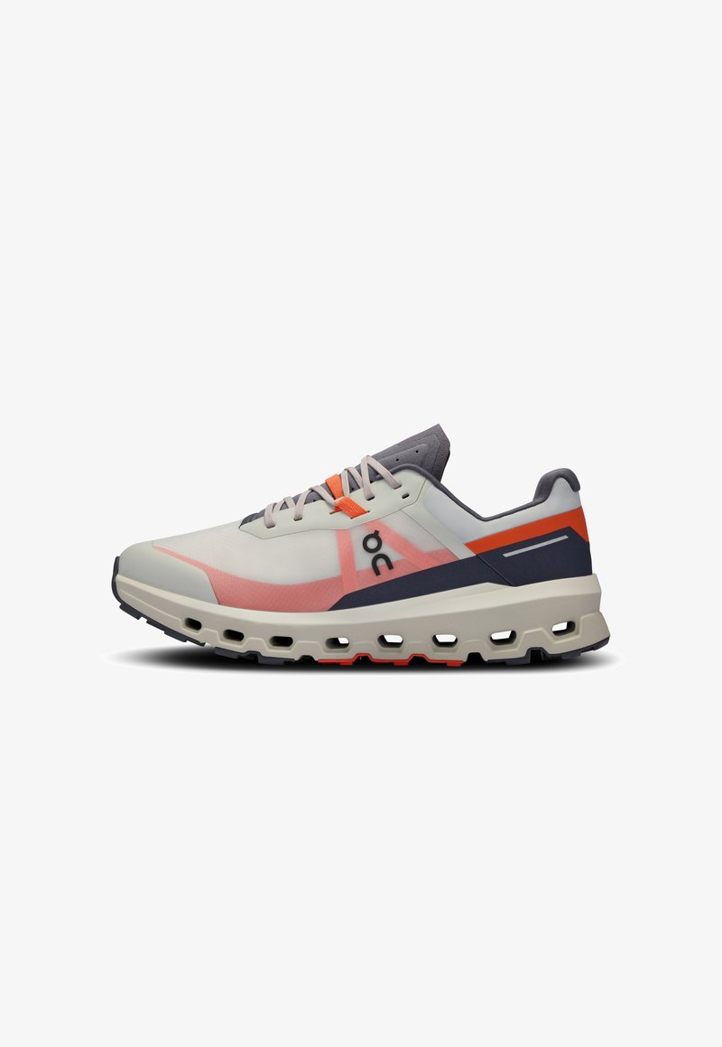 Running shoe in light beige and pink, featuring a breathable upper, padded tongue, orange accents, and a cushioned black sole.