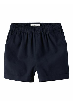 Pantaloncini blu navy per bambini piccoli con cintura elastica, tasche frontali laterali e orli risvoltati, etichetta con la taglia visibile all'interno della vita.