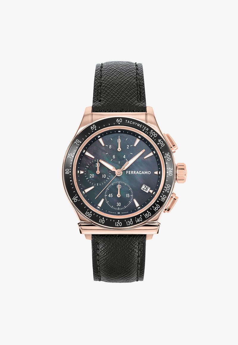 Kronograaf kellad tekstureeritud musta nahkraja, roosa kulla korpus ja tume sihverplaat, millel on kolm alasihverplaati ja kuupäeva näidik.