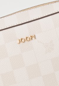 Beige faux leather pouch with a checkered pattern, featuring a gold logo "JOOP!" and a gold zipper. Smooth texture with tonal stitching.