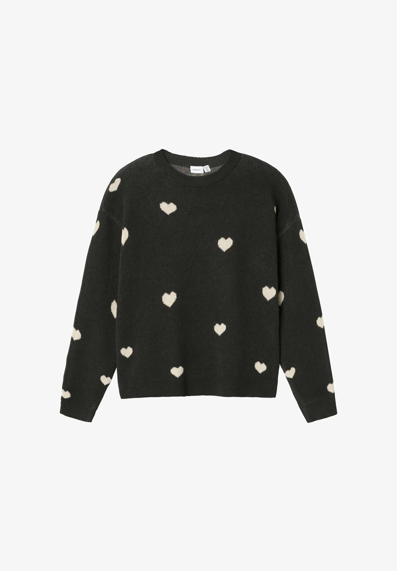 Suéter negro con cuello redondo y mangas largas, que presenta patrones de corazones en color crema. Textura suave, puños y dobladillo acanalados.