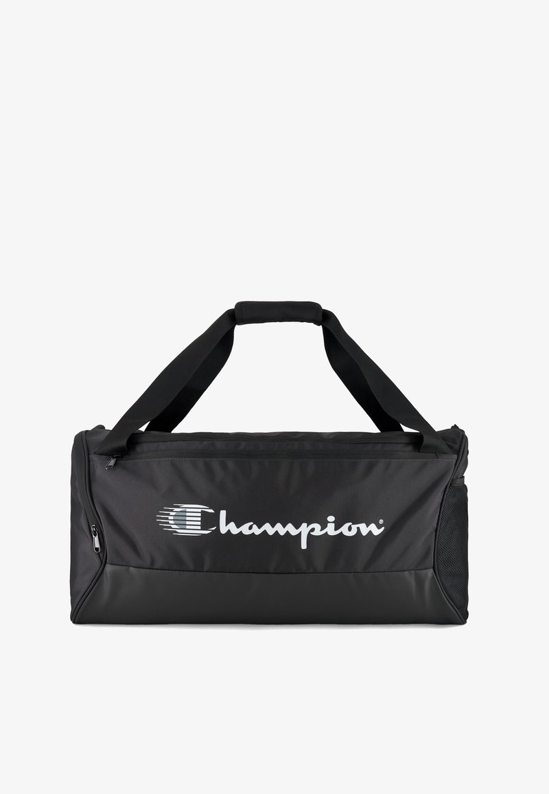 Borsa da viaggio nera in tela con manici rinforzati neri, chiusura con zip e tasca laterale in rete. Presenta un grande logo bianco "Champion". Materiale resistente.